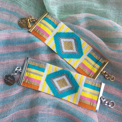 Yellow Athena rainbow bracelet with colorful cuff design, featuring vibrant rainbow-colored beads and a stylish bracelet style.