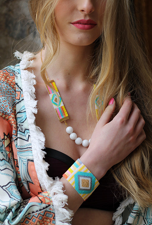 Colorful rainbow bracelet set by Yellow Athena, featuring vibrant, woven bracelets with bright rainbow patterns and adjustable clasps.