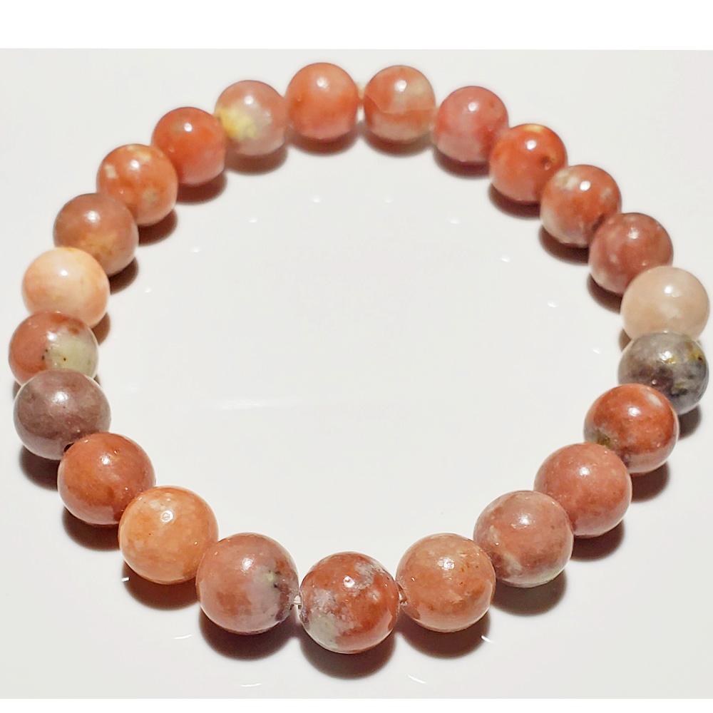 8mm Rhodochrosite beaded elastic stretch bracelet by Silver Hestia featuring vibrant pink and red gemstone beads.