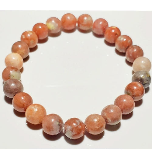 8mm Rhodochrosite beaded elastic stretch bracelet by Silver Hestia, showcasing vibrant pink and red gemstone beads.