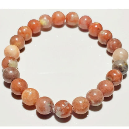 8mm Rhodochrosite beaded elastic stretch bracelet by Silver Hestia, showcasing vibrant pink and red gemstone beads.
