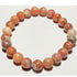 8mm Rhodochrosite beaded elastic stretch bracelet by Silver Hestia, showcasing vibrant pink and red gemstone beads.