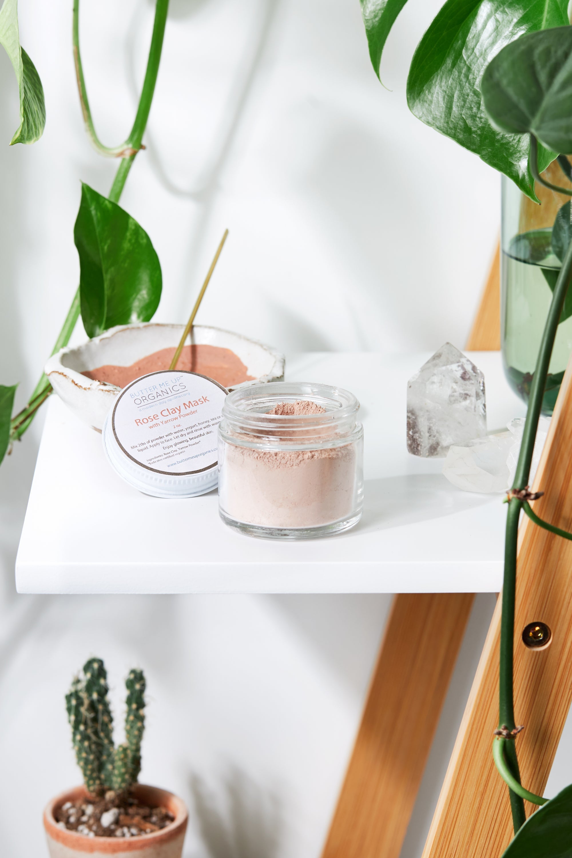 White Smokey Rose Clay Face Mask in a jar, showing the pink clay and creamy texture ready for skincare application.