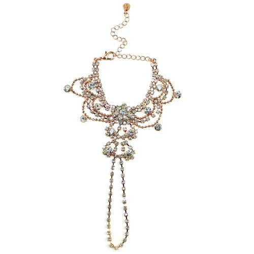 Rose gold draping crystals handpiece bracelet by Cyan Ismene featuring intricate crystal detailing on a delicate handchain.