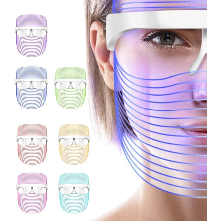 Maroon Asteria LED light therapy facial mask with 7 colors for anti-aging and wrinkle reduction, shown on a user&