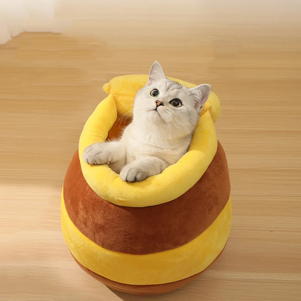 Yellow Pandora honey jar themed cat bed, cozy and adorable, designed for comfortable feline lounging and resting.