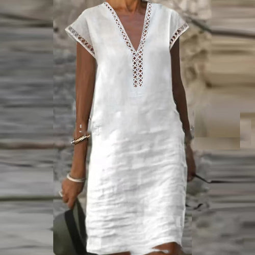 Elegant cotton linen dress by Yellow Eleusis, displayed with a focus on the fabric texture and stylish design.