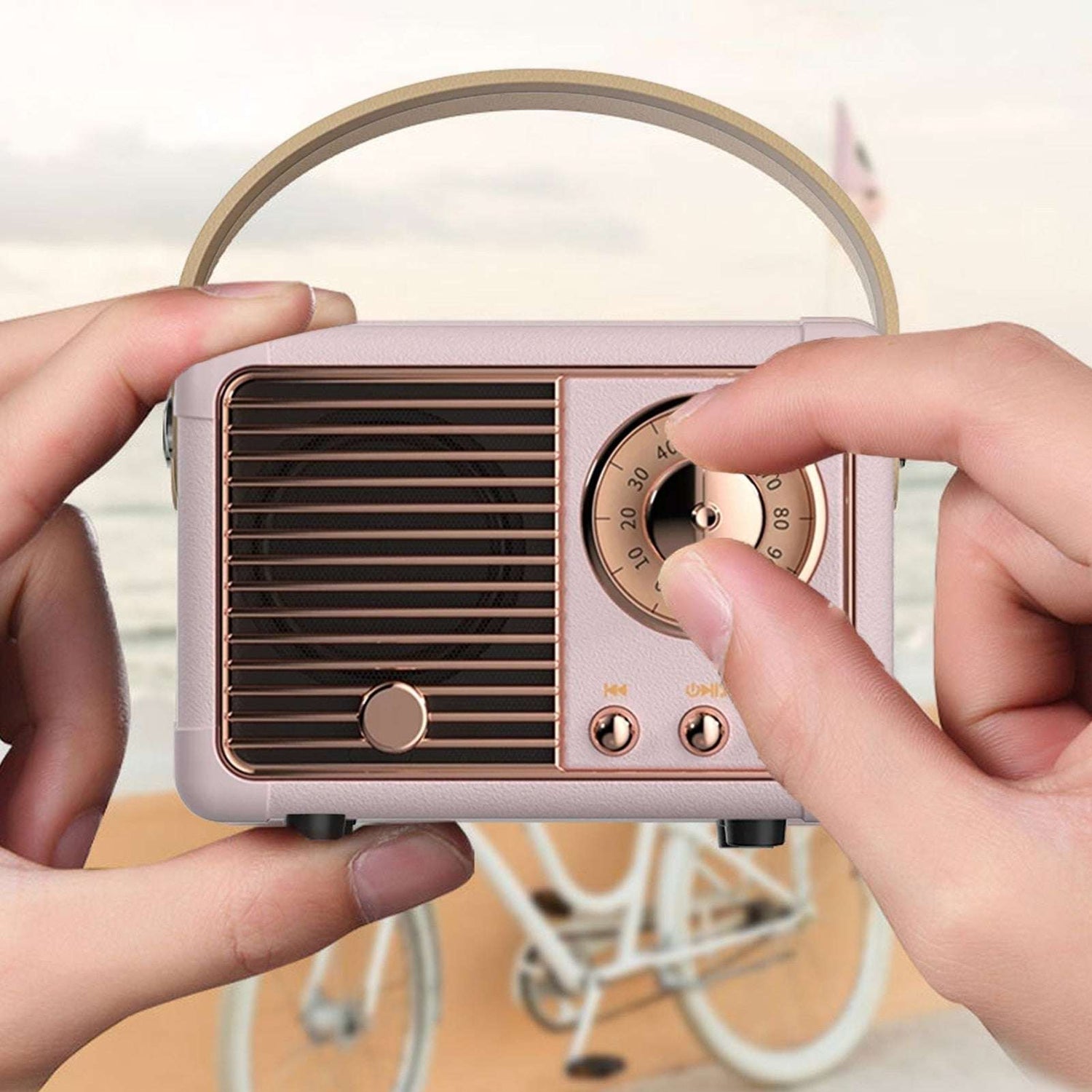 Yellow Pandora Bluetooth compact retro speaker with built-in radio, featuring a vintage design and portable audio functionality.