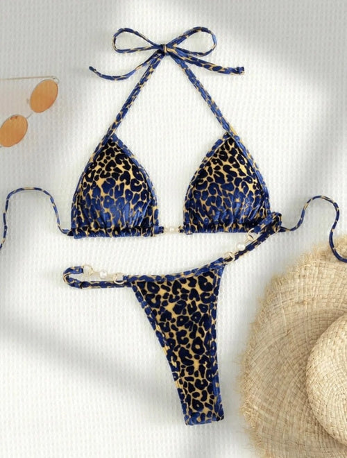Raspberry Eurybia Sara two-piece swimsuit with a stylish bikini top and matching bottoms, perfect for beach or poolside wear.