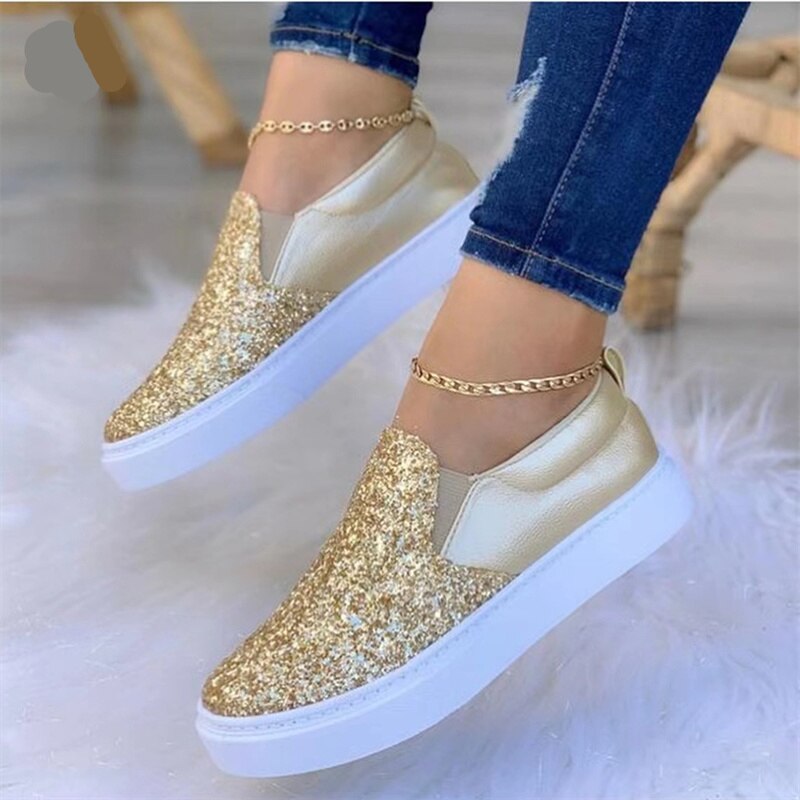 Red Iphigenia crystal flat moccasins for women in gold, black, and rose gold with decorative embellishments and a comfortable slip-on design.