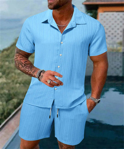 Raspberry Eurybia Irie men beach shorts set featuring colorful swimwear with tropical print for beach or poolside wear.