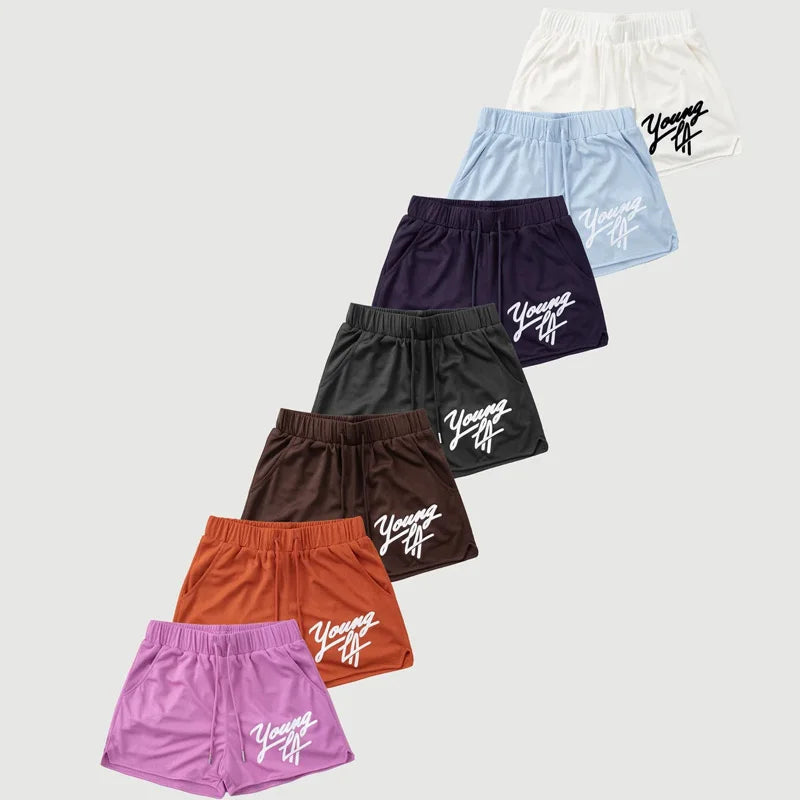 Raspberry Eurybia Young LA trendy beach shorts with colorful floral pattern and relaxed fit, perfect for summer beach days.
