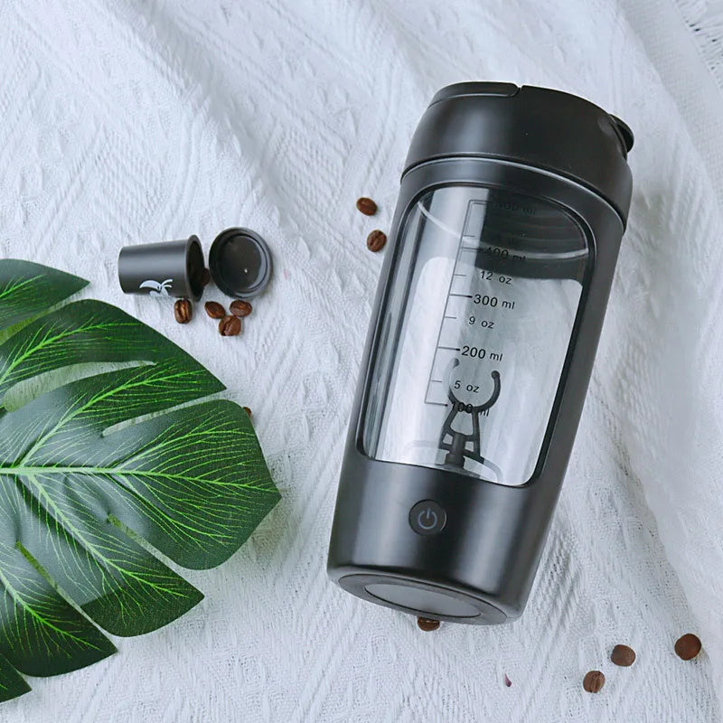Maroon Asteria USB electric protein shaker bottle with a transparent body and black lid, featuring a compact design for on-the-go use.