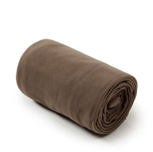 Yellow Pandora lightweight polar fleece camping sleeping bag laid out outdoors with a mountain backdrop.
