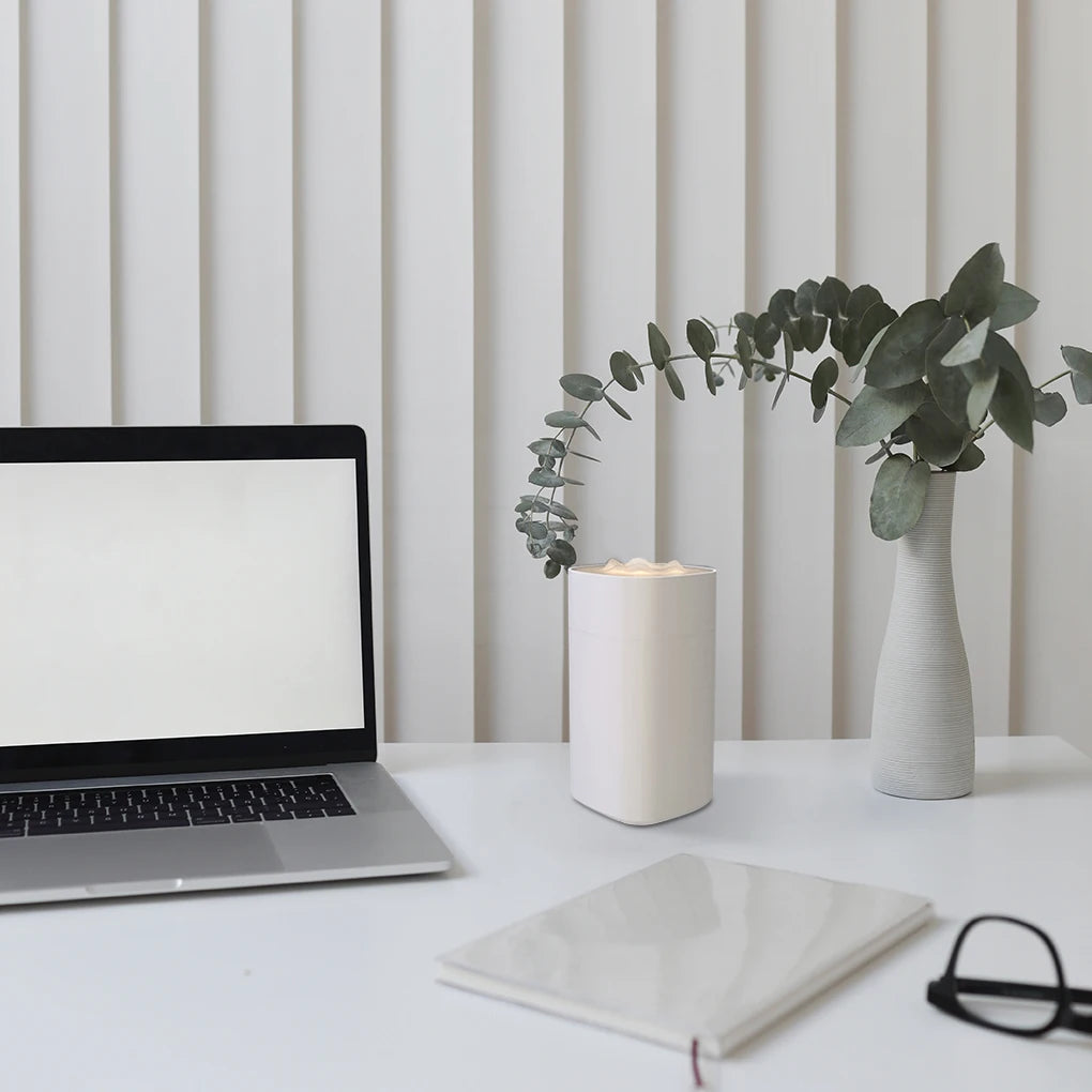 Maroon Asteria portable mini humidifier with small spray nozzle, desktop design, quiet operation, and aroma diffuser feature.