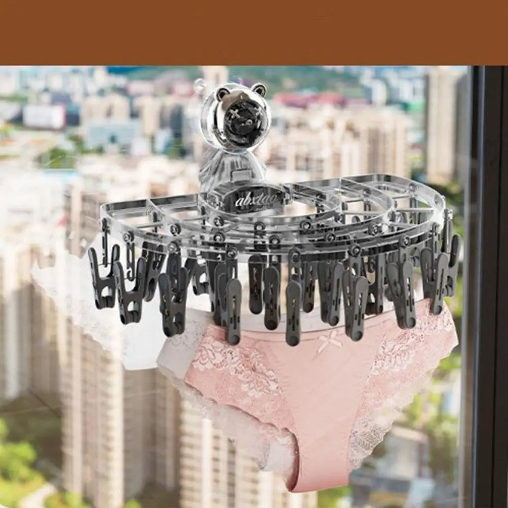 Maroon Asteria suction cup sock hanger with clips, foldable and retractable for organized sock drying on smooth surfaces.