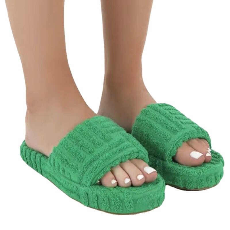 Red Iphigenia thick bottom embossed cotton fur women’s slippers with cozy, plush interior and stylish embossed design.