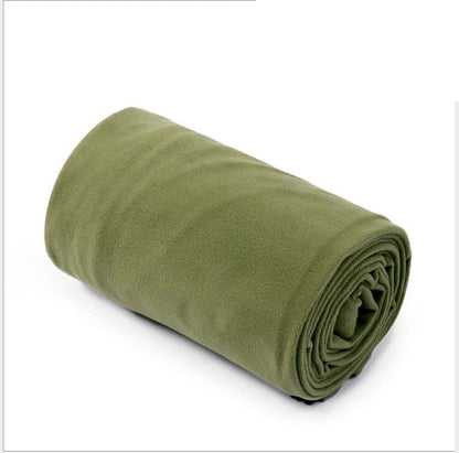 Yellow Pandora lightweight polar fleece camping sleeping bag laid out outdoors for camping, showing its cozy, insulated interior.