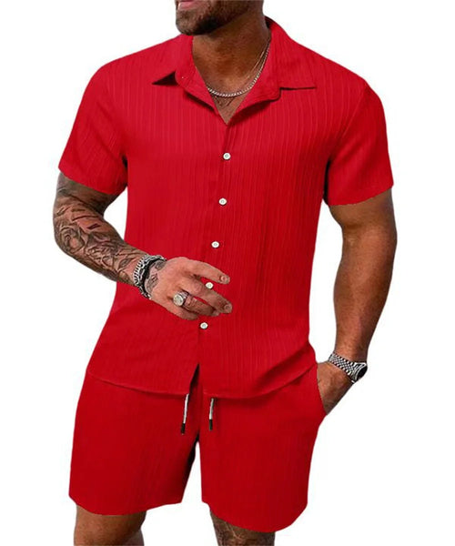 Raspberry Eurybia Irie Men Beach Shorts Set, colorful swimwear with tropical print, displayed on a model ready for the beach.