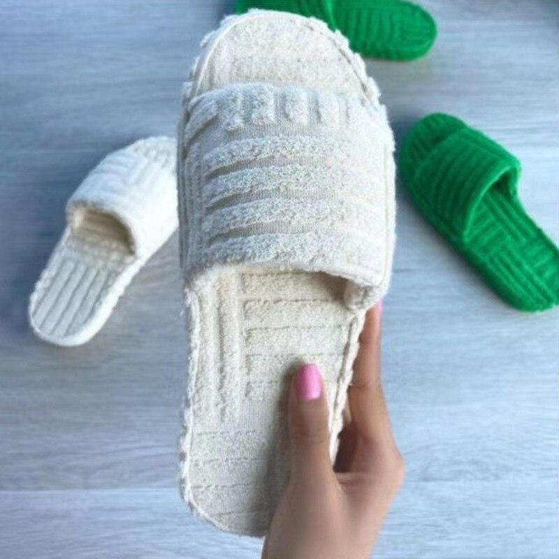 Red Iphigenia thick bottom embossed cotton fur slippers with plush interior and stylish design for cozy indoor wear.