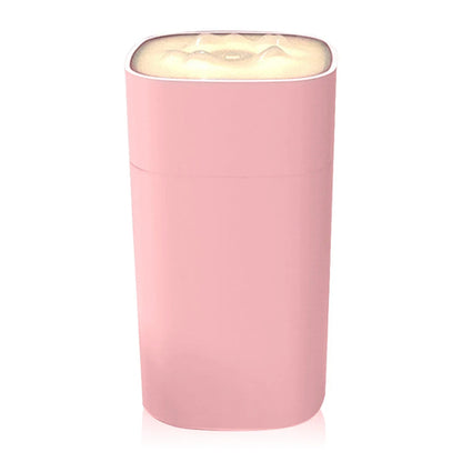 Maroon Asteria portable mini humidifier with small spray nozzle, desktop design, emits mist for home improvement use.