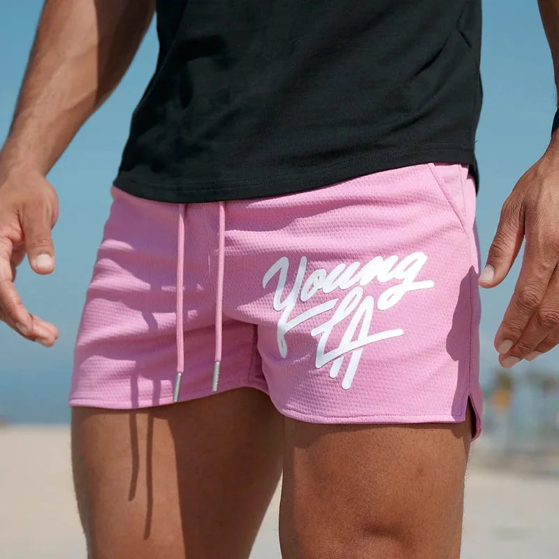 Raspberry Eurybia Young LA trendy beach shorts with colorful tropical print, casual fit, and drawstring waist for summer beachwear.