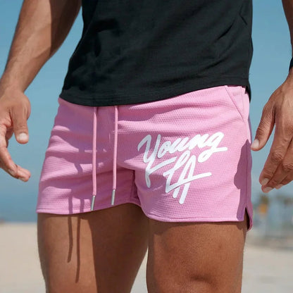 Raspberry Eurybia Young LA trendy beach shorts with colorful tropical print, casual fit, and drawstring waist for summer beachwear.