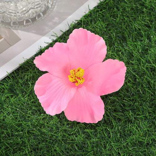 Raspberry Eurybia Hawaiian flower hair clip with vibrant floral design, perfect for adding a tropical touch to hairstyles.