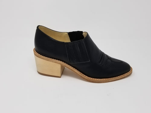 Black Santa Ana footwear by Azure Ophion, showcasing stylish and comfortable shoes with a sleek design.