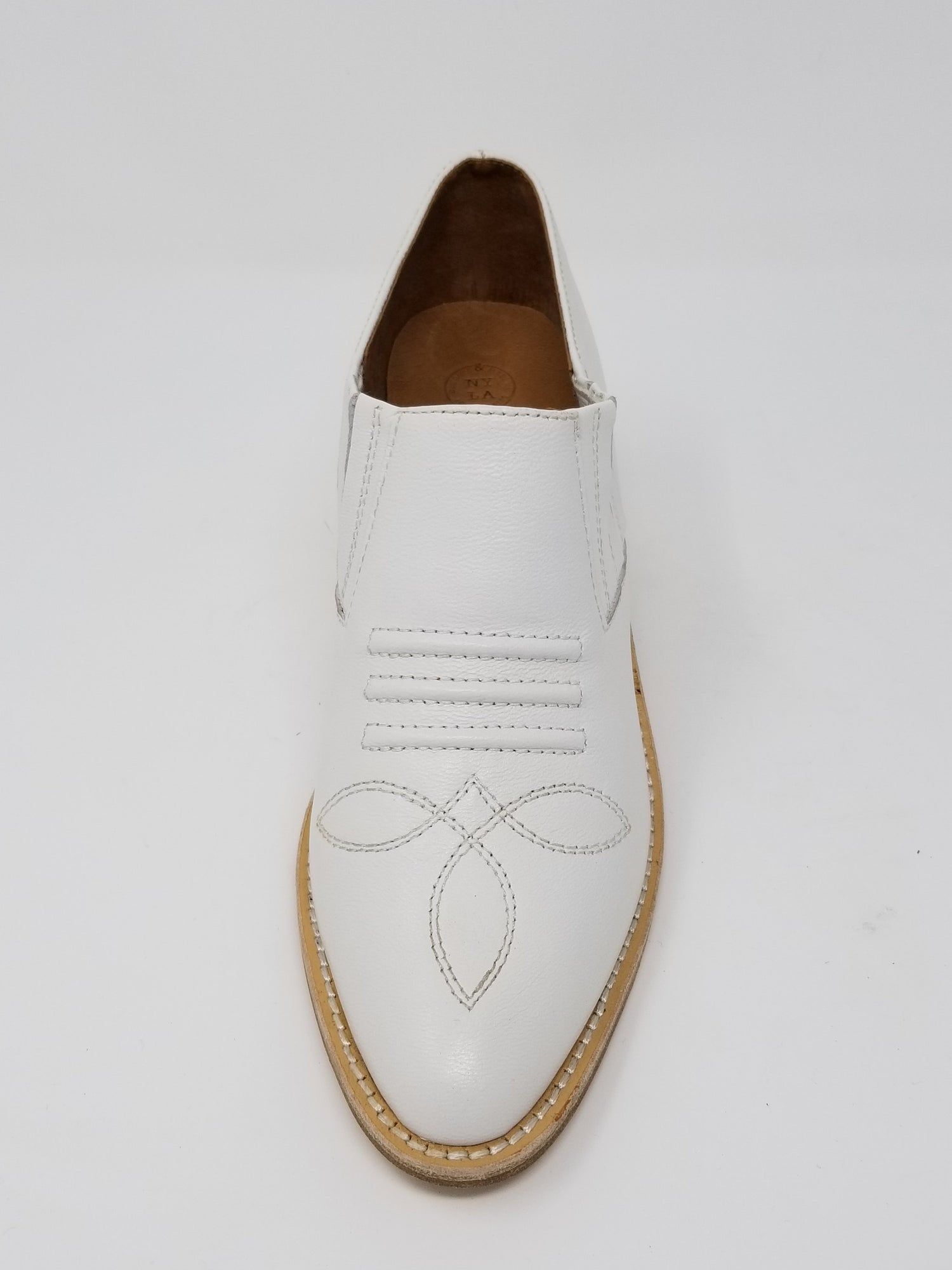 White Santa Ana footwear by Azure Ophion, front view showing sleek design and comfortable fit.