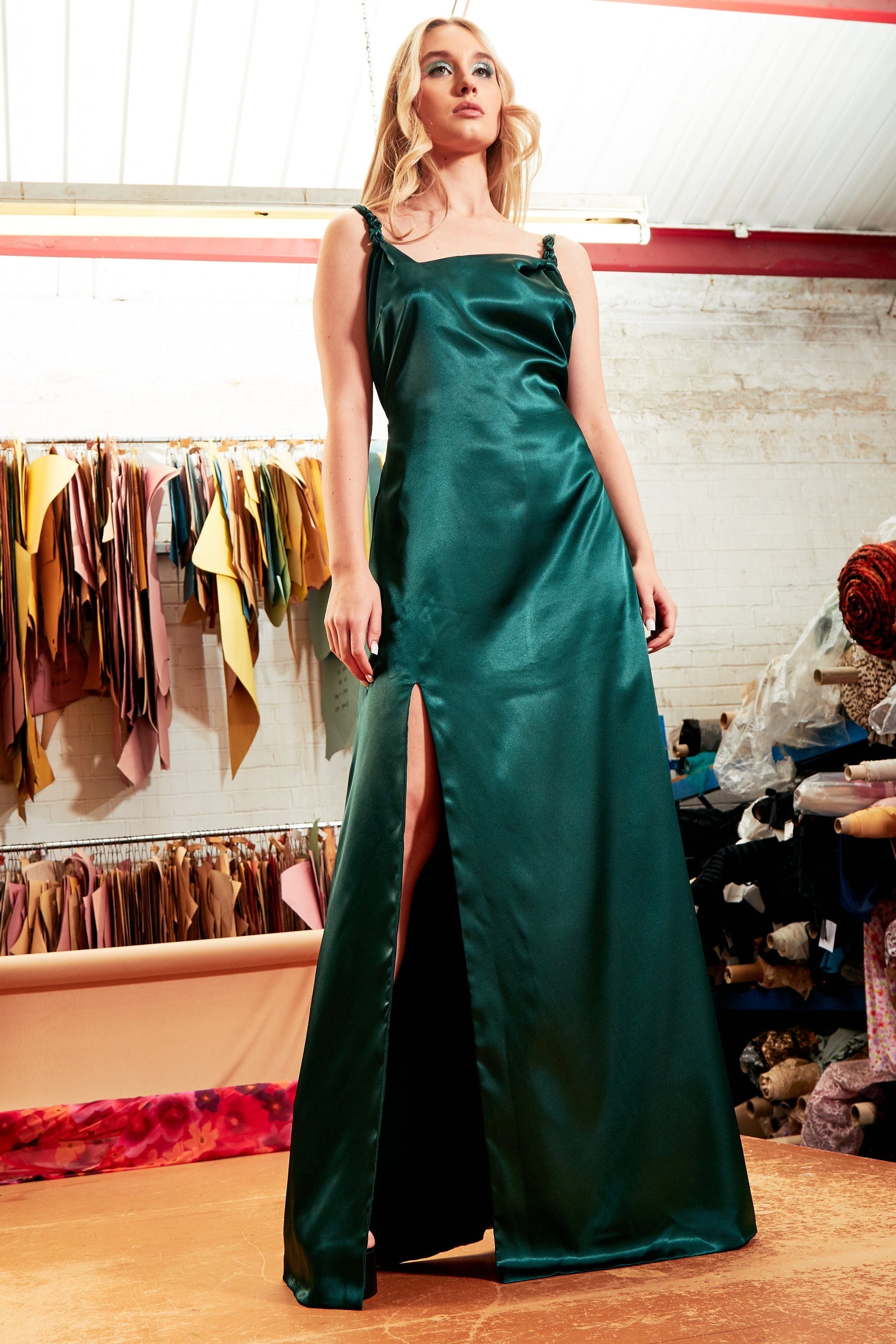 Emerald green maxi dress by Blush Athena featuring flowing fabric and a stylish neckline, perfect for elegant occasions.