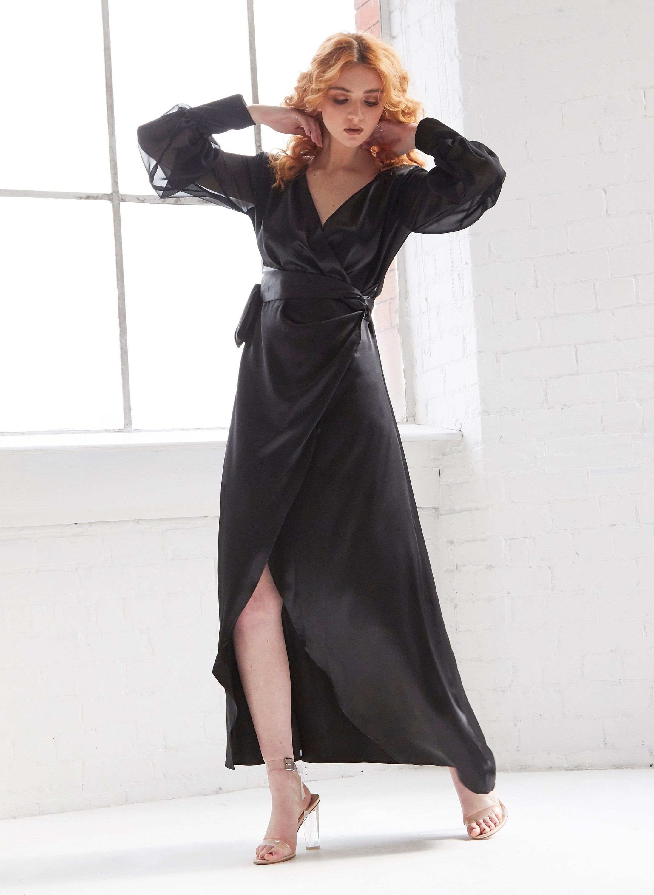 Black wrap maxi dress by Blush Athena featuring a flowing silhouette and elegant design, perfect for formal occasions.