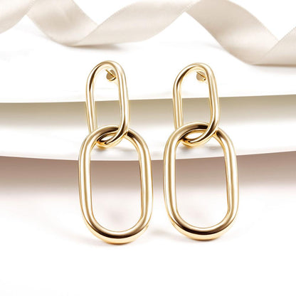 Interlocking hoop earrings by Lavender Phoebe, stylish jewelry featuring shiny silver hoops with a modern design.