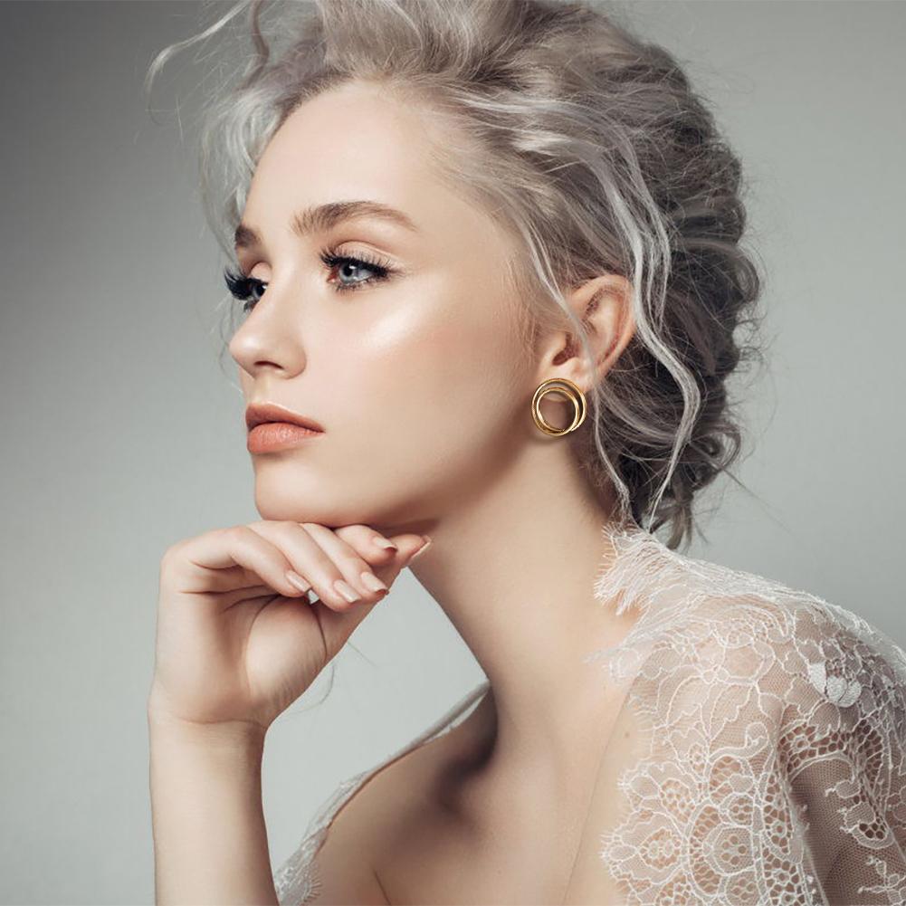 Lavender Phoebe double layered hoop earrings with silver-tone finish, showcasing stylish jewelry design with two overlapping hoops.
