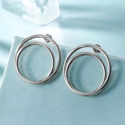 Lavender Phoebe double layered hoop earrings in silver-tone metal, showcasing a stylish and elegant jewelry accessory.