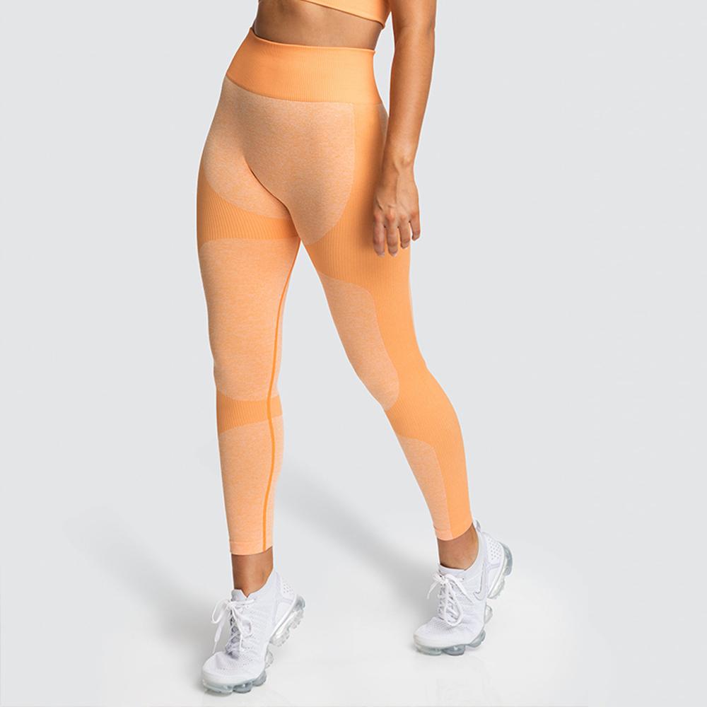 Yellow high waist seamless yoga leggings and stretch sports bra from Amethyst Hera activewear set, designed for comfort and flexibility.