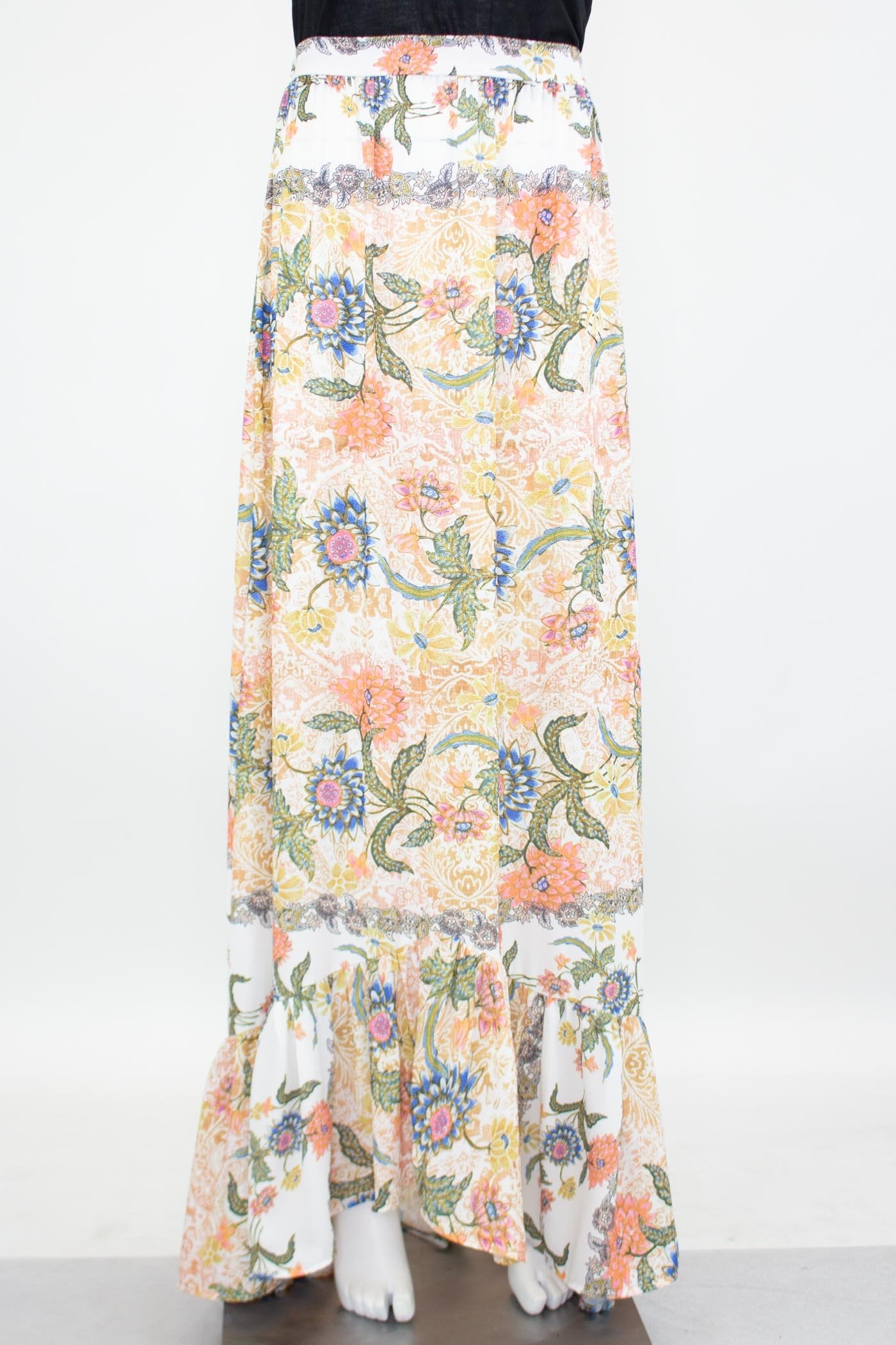 Yellow Hera floral maxi skirt with flared bottom, featuring vibrant flower patterns and flowing fabric.