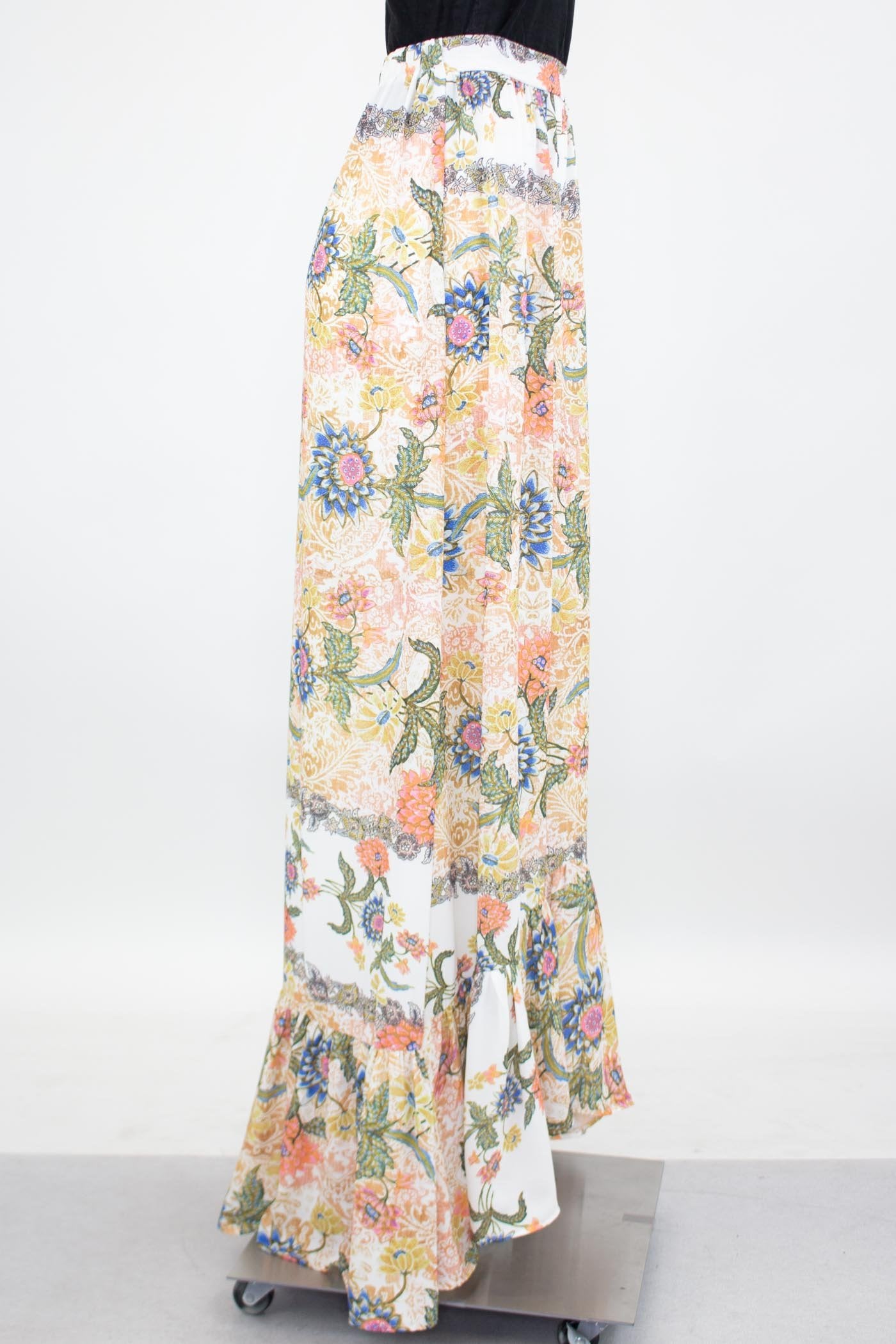 Yellow Hera floral maxi skirt with flared bottom, featuring vibrant flower patterns and flowing fabric for a stylish look.