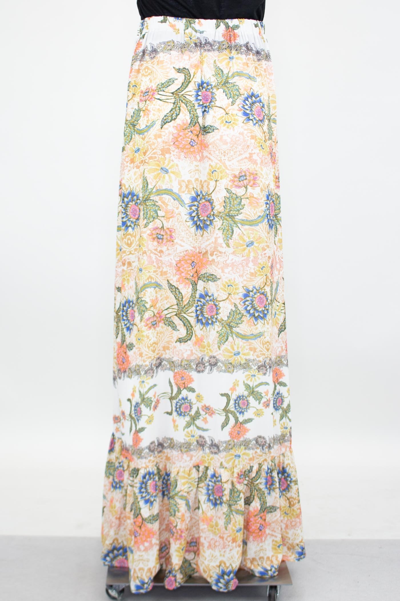 Yellow Hera floral maxi skirt with a flared bottom, featuring vibrant flower patterns and flowing fabric.