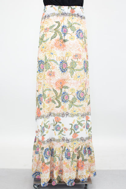 Yellow Hera floral maxi skirt with a flared bottom, featuring vibrant flower patterns and flowing fabric.