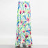 Yellow Hera flared bottom tropical maxi skirt with vibrant floral print, flowing fabric, and high-waisted design.