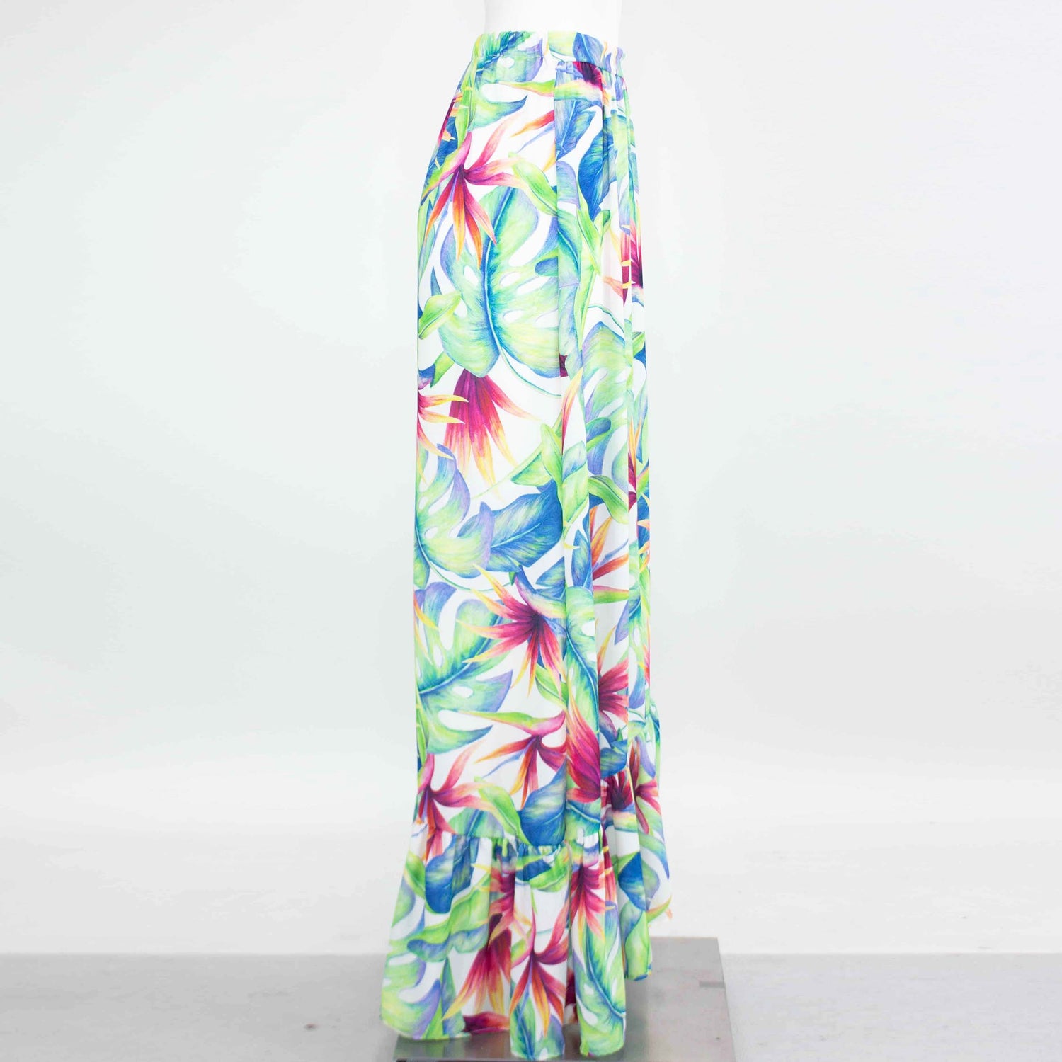 Yellow Hera tropical maxi skirt with flared bottom, featuring vibrant floral patterns and lightweight flowy fabric.