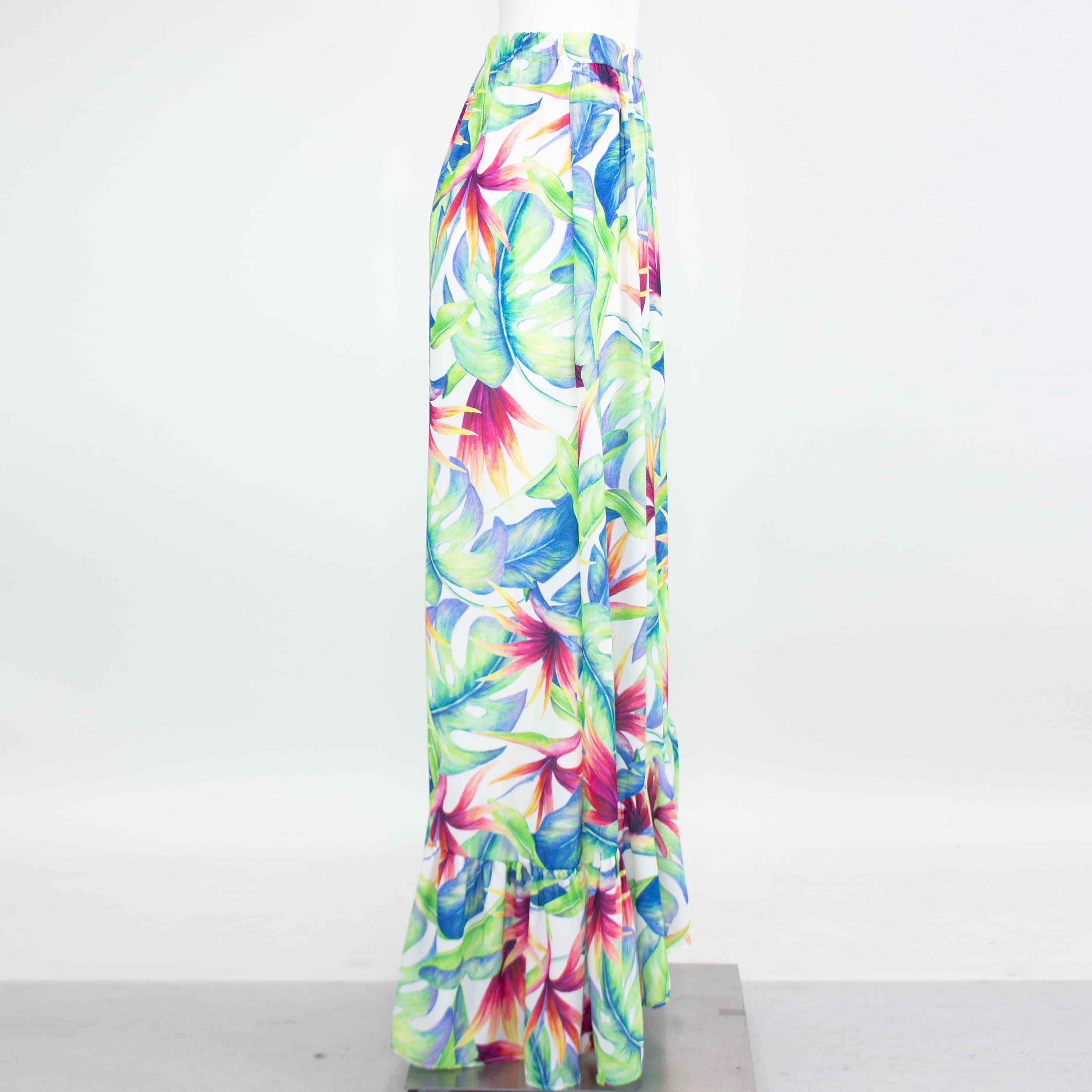 Yellow Hera tropical maxi skirt with flared bottom, featuring vibrant floral patterns and lightweight flowy fabric.