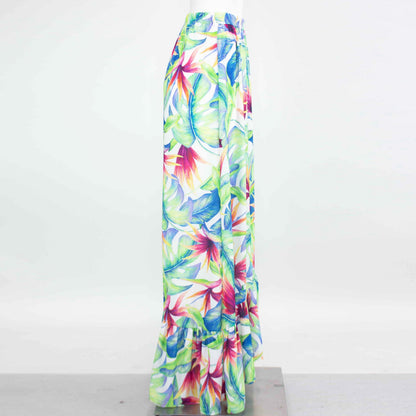 Yellow Hera tropical maxi skirt with flared bottom, featuring vibrant floral patterns and lightweight flowy fabric.