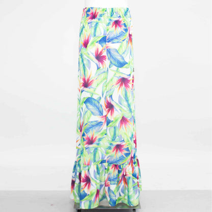 Yellow Hera flared bottom tropical maxi skirt with vibrant floral print, flowing fabric, and high waist design.