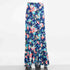 Yellow Hera flared bottom flower maxi skirt, flowing clothing with vibrant floral pattern, perfect for boho or casual style.
