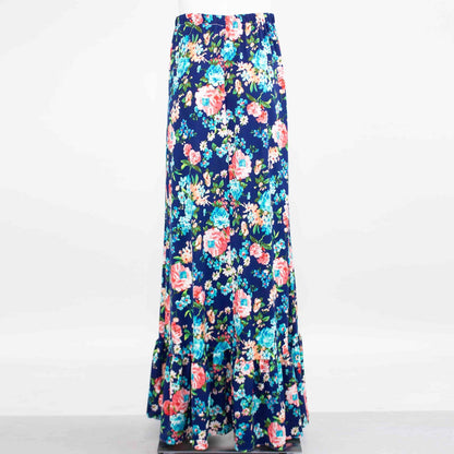 Yellow Hera flared bottom flower maxi skirt with vibrant floral pattern, flowing fabric, and high-waisted design.