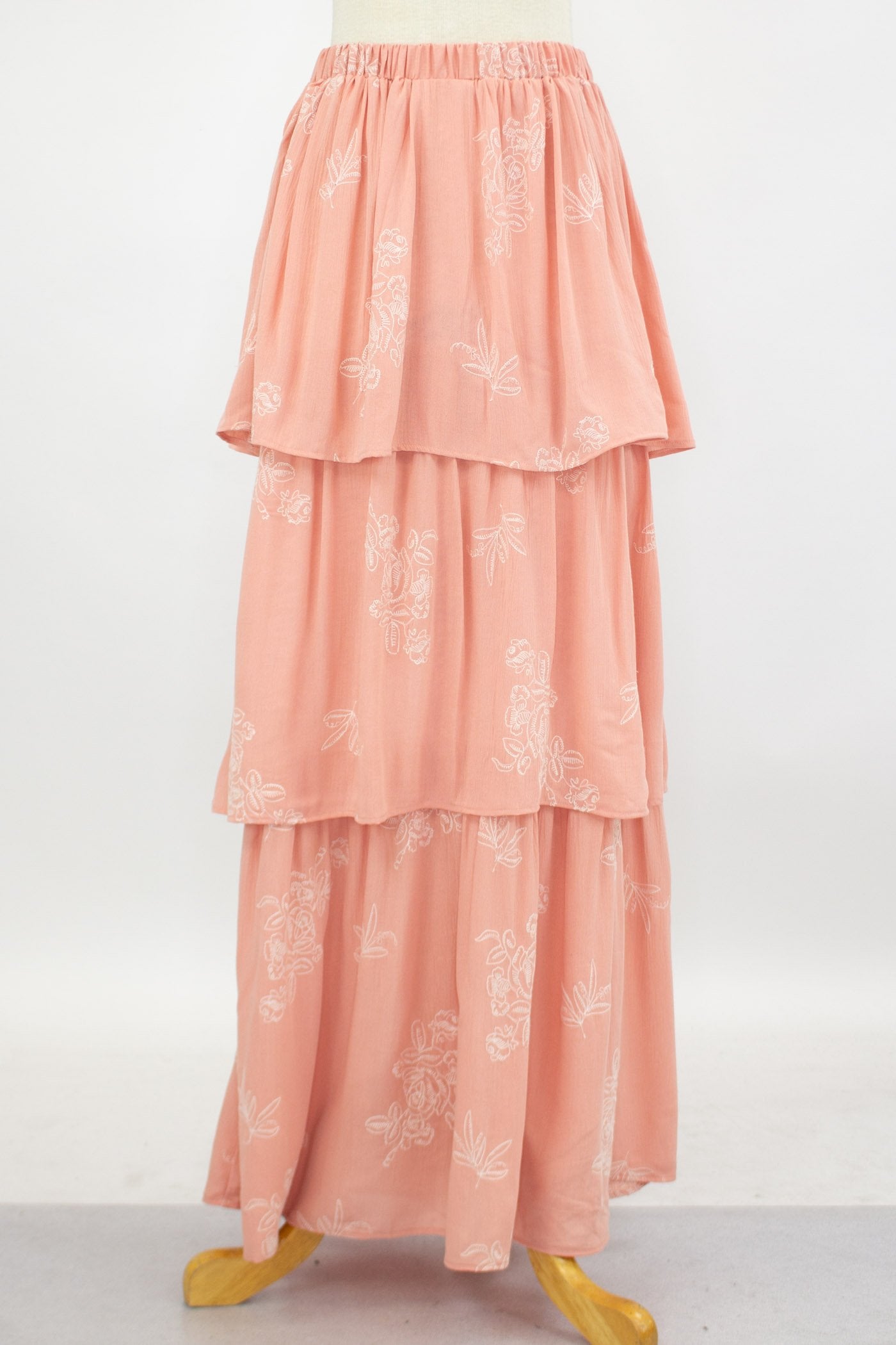 Yellow Hera layered ruffle maxi skirt in blush pink, flowing fabric with multiple ruffles, perfect for elegant summer outfits.
