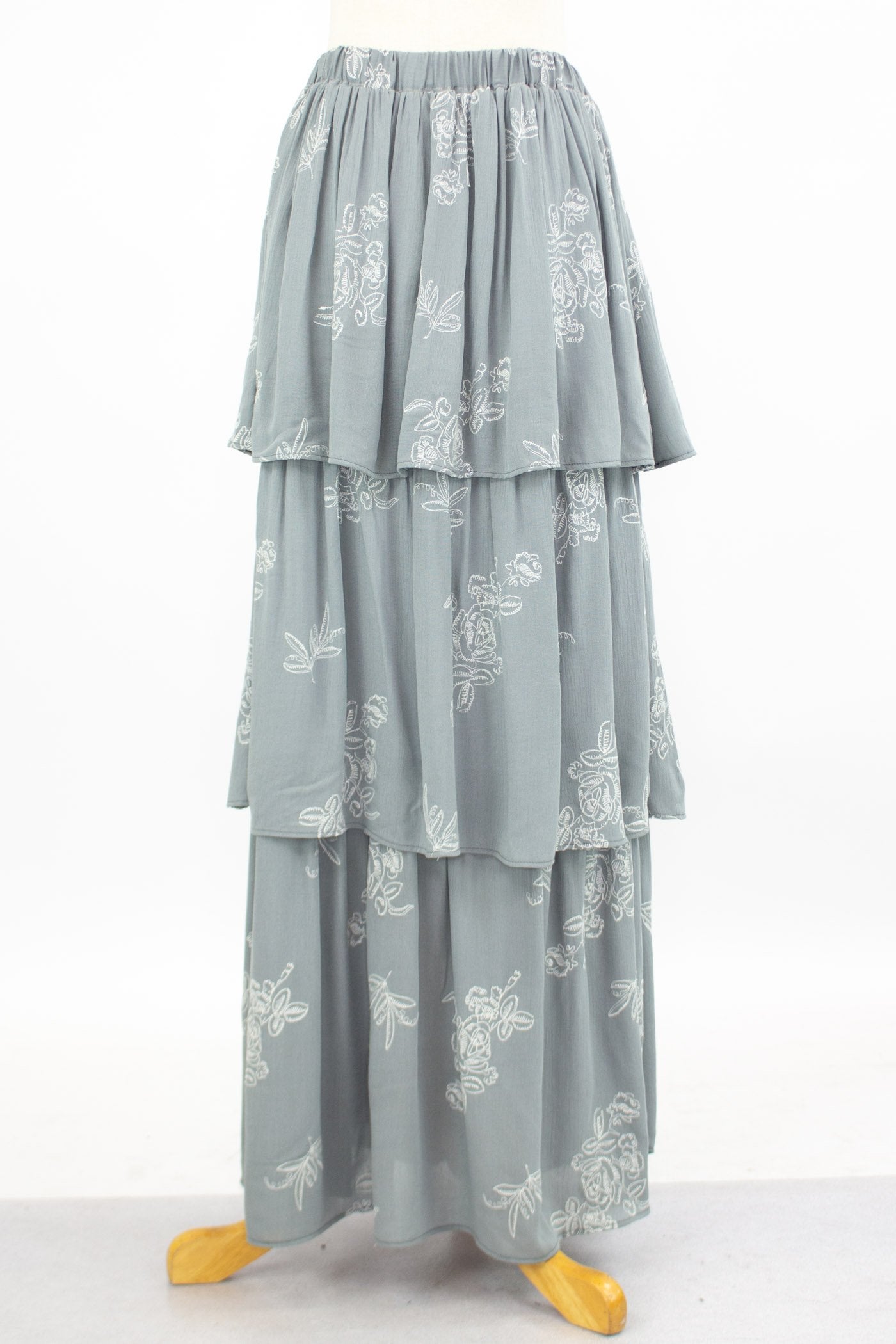 Grey layered ruffle maxi skirt by Yellow Hera, featuring flowing fabric and tiered design for a stylish, bohemian look.