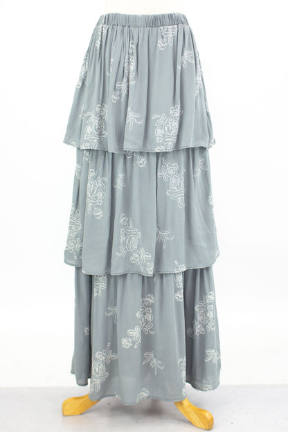 Grey layered ruffle maxi skirt by Yellow Hera, flowing design with tiered fabric, perfect for casual or dressy occasions.